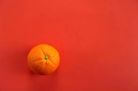 Fruit orange on red background Stock Photos