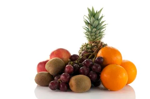 Fruit as oranges pineapple grapes and kiwi Foto stock