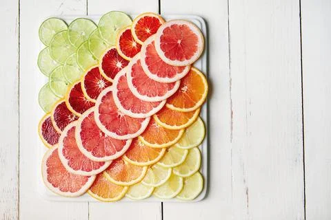 Fruit, pattern and citrus on plate in kitchen for organic snack, healthy ea.. 库存照片
