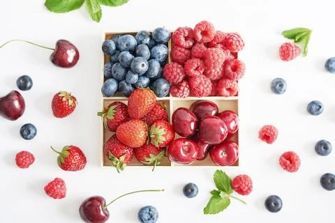 Fruit pattern of colorful fresh berries on white background. Top view. Flat l Stock Photos