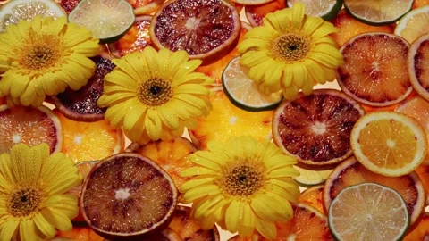 Fruit pattern of orange slices and blossom with leaves on green background. Top Stock Footage 248542865