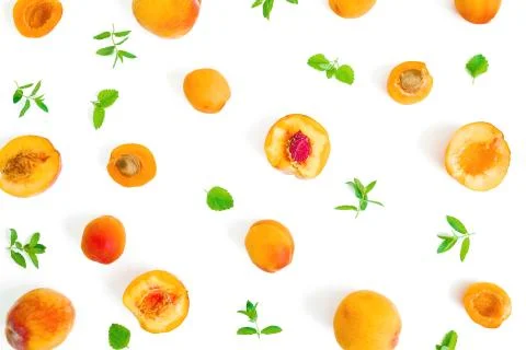 Fruit pattern of ripe apricot and peaches with leaves on white background. Fl 写真素材
