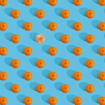 Fruit pattern of tangerine on blue background. Stock Photos