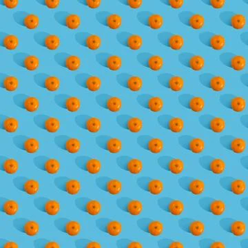 Fruit pattern of tangerine on blue background. Stock Photos