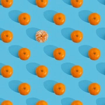 Fruit pattern of tangerine on blue background. 스톡 사진