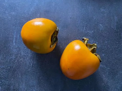 Fruit persimmon on the dark background Foto stock