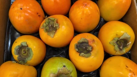 Fruit persimmons displayed on the fruit stand Stock Footage 288239957