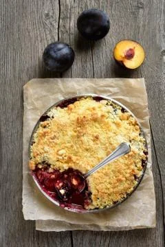 Fruit pie with fresh plums Stock Photos