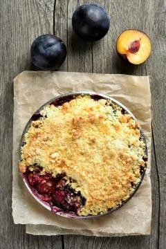 Fruit pie with plums Stock Photos