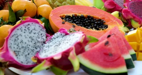 Fruit platter with dragon fruit, kiwi, pineapple, and assorted fresh tropical Stock Footage 314497853