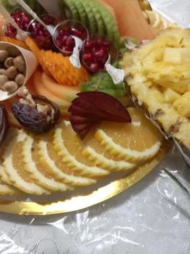 Fruit platter in the form of a pineapple and other fruits Stock Photos