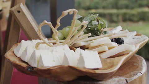 Fruit platter, grape, nuts, cheese, mint, bee honey, wooden platter, cheese Stock Footage 154743027