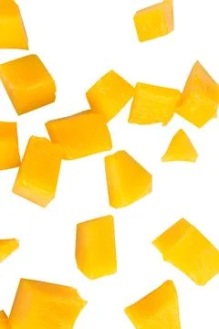 Fruit pulp cube piece mango fall isolated on white background Stock Photos
