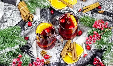 Fruit punch drinks with berries and lemon slices on table Stock Photos