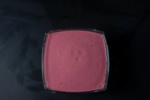 Fruit puree on a black background Stock Photos