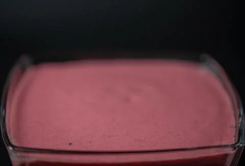 Fruit puree on a black background Stock Photos