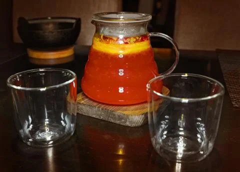 Fruit red tea drink and two glasses Stock Photos