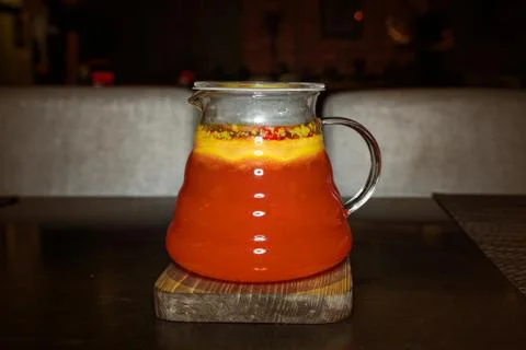 Fruit red tea in a transparent teapot Stock Photos