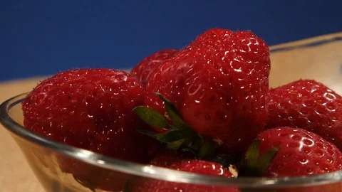 Fruit rotating wet strawberries Stock Footage