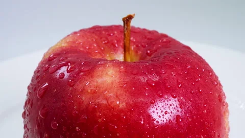 Fruit on a round table - Red apple - close up Stockbeeldmateriaal 145676404