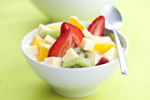 Fruit salad with chunks of fruit and yogurt Stock Photos