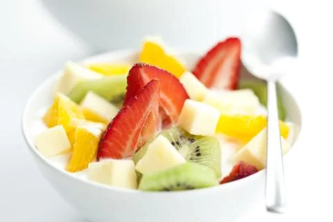 Fruit salad with chunks of fruit and yogurt Stock Photos