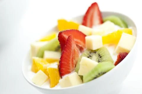 Fruit salad with chunks of fruit and yogurt Stock Photos