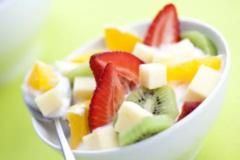Fruit salad with chunks of fruit and yogurt Stock Photos