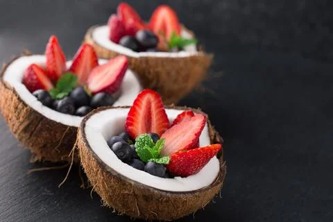 Fruit salad in coconut Stock Photos
