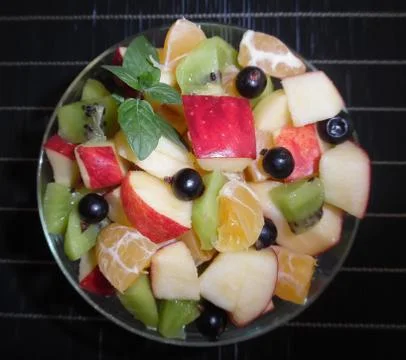 Fruit salad on a dark background Foto stock