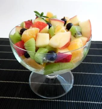 Fruit salad on a dark background Stock Photos