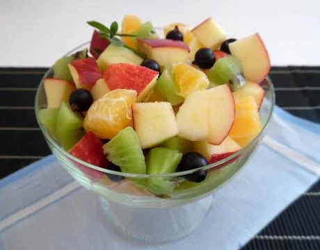 Fruit salad on a dark background Stock Photos