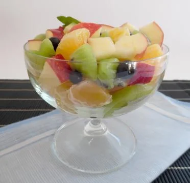 Fruit salad on a dark background Stock Photos