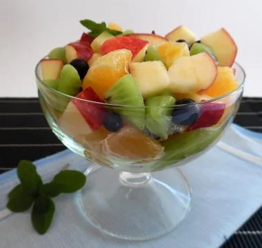 Fruit salad on a dark background Stock Photos