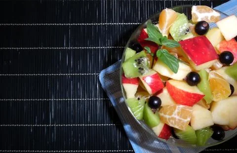 Fruit salad on a dark background Foto stock