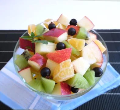 Fruit salad on a dark background Stock Photos