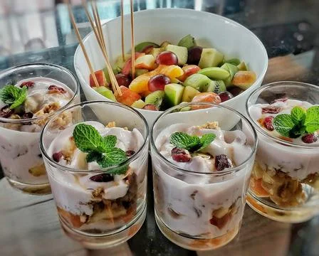 Fruit salad is a dish consisting of various kinds of fruit, sometimes served  Stock-Fotos