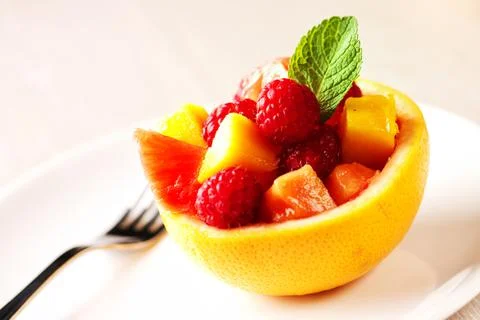Fruit Salad in Half Grapefruit with Mint Leaf Stock Photos