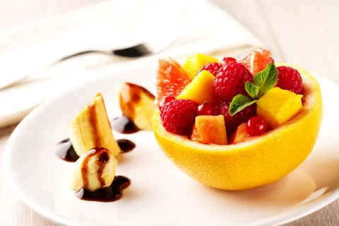 Fruit Salad in Half Grapefruit with Mint Leaf Stock Photos