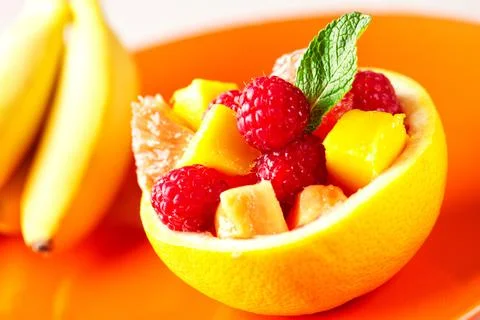 Fruit Salad in Half Grapefruit with Mint Leaf Stock Photos