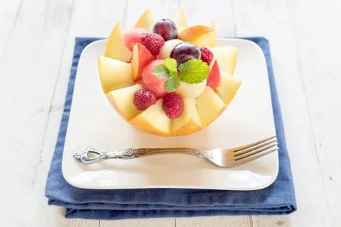 Fruit salad in melon Stock Photos