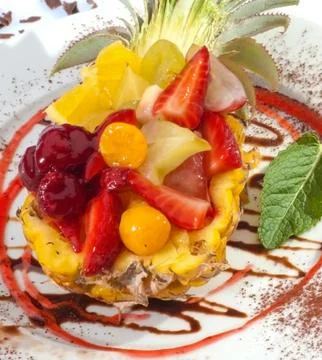 Fruit salad in pineapple Stock Photos