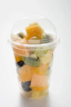 Fruit salad in a plastic beaker Stock Photos