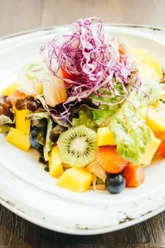 Fruit salad with vegetable in plate Stock Photos