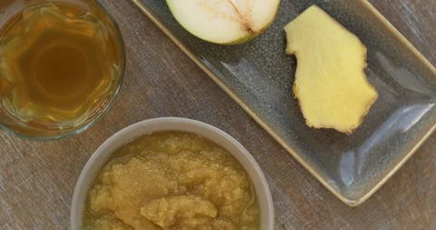Fruit sauce made of kombucha fermented pear with ginger. Table spin. Stock Footage 278235703