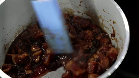 Fruit sautéed in a pan to make jam Stock Footage 293494150