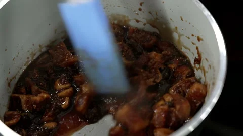 Fruit sautéed in a pan to make jam Stock Footage 307013481