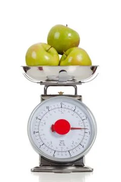 Fruit on a scale with a white background Stock Photos