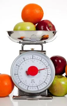 Fruit on a scale with a white background Stock Photos