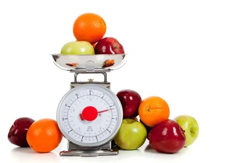 Fruit on a scale with a white background Stock Photos